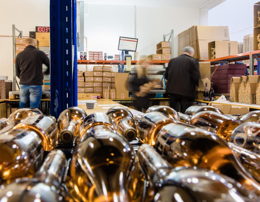 staff packing orders in the warehouse 