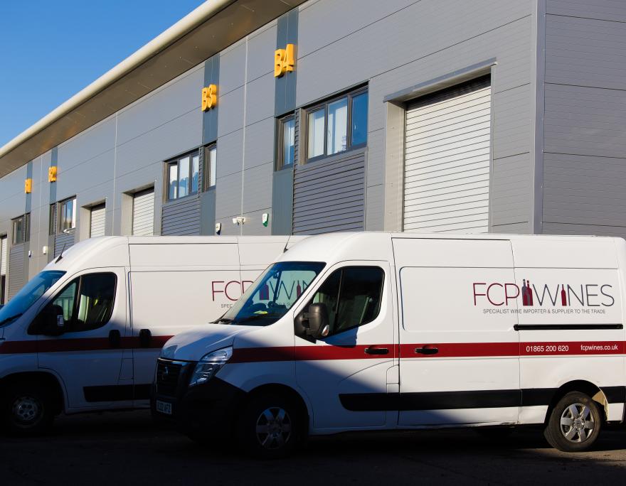 Vans outside warehouse