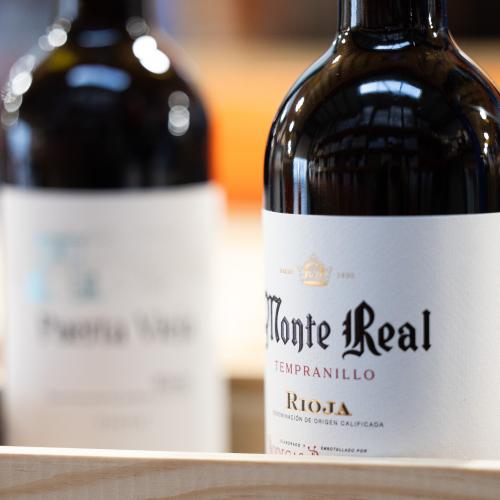 2 bottles of red wine the second bottle in the background blurred out 