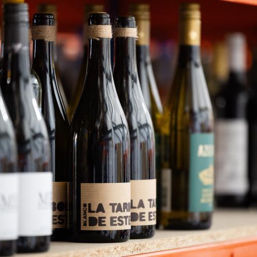 Red wines on a shelf in the warehouse
