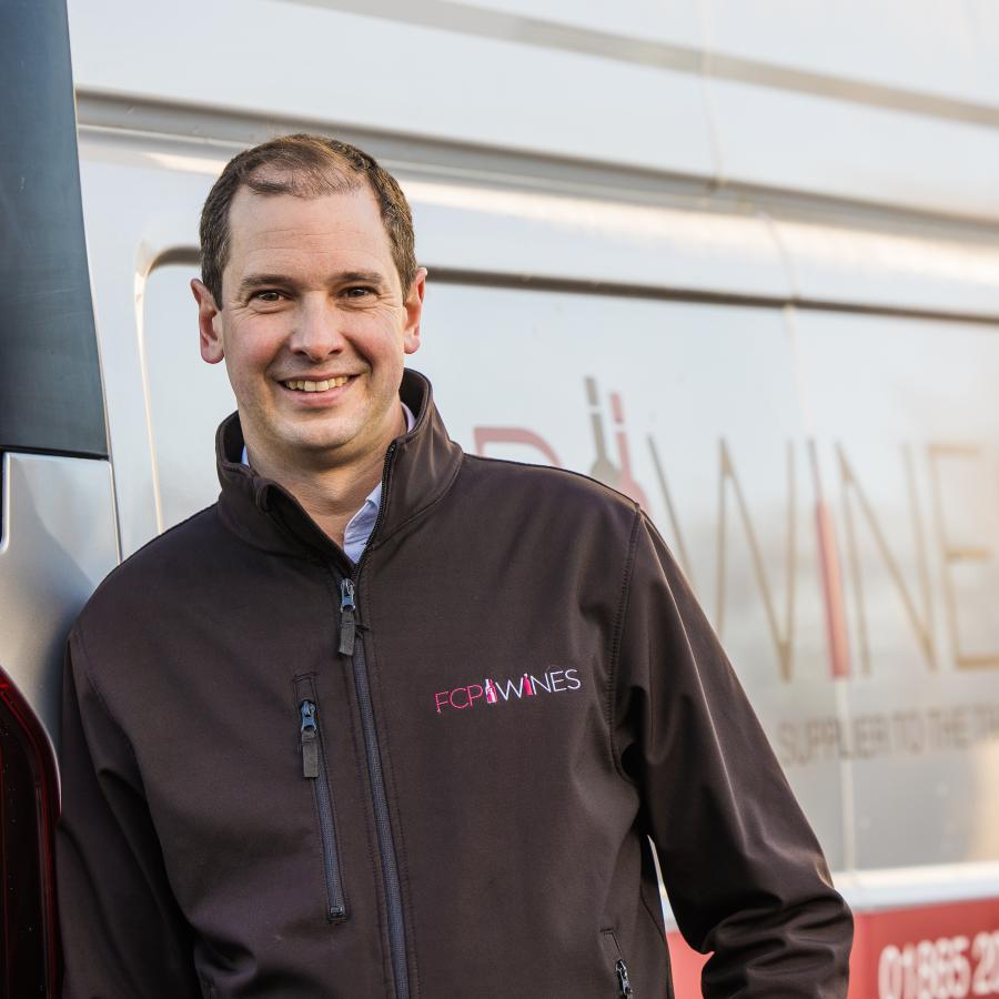 Tom standing by the first class product van 