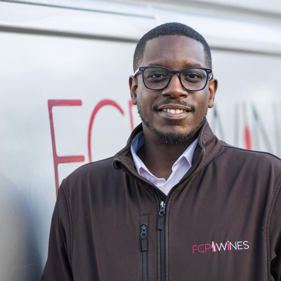 Theo Woods standing by the delivery van 