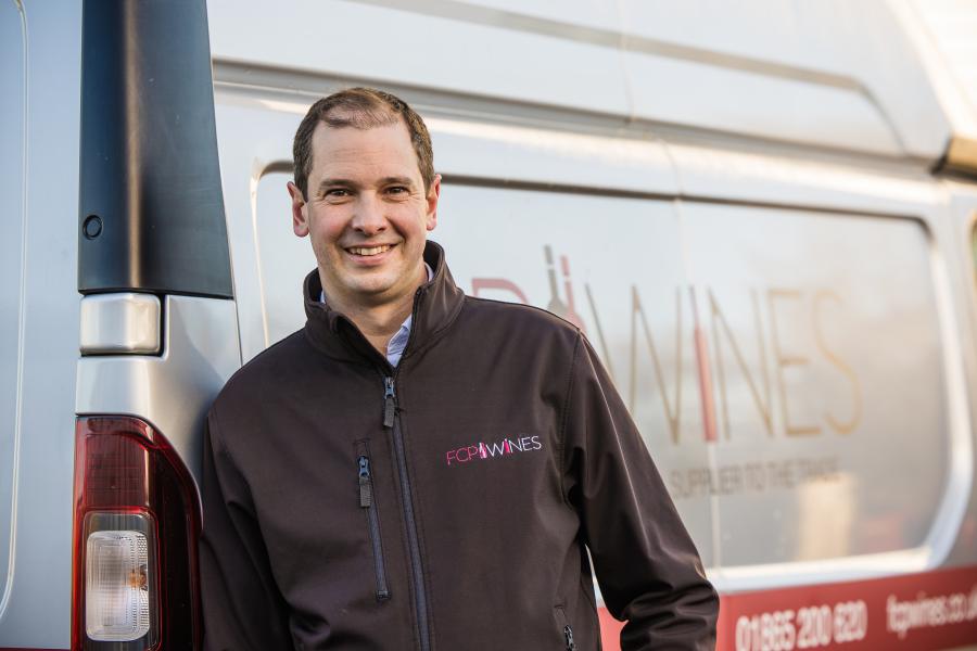 Tom standing by the first class product van 