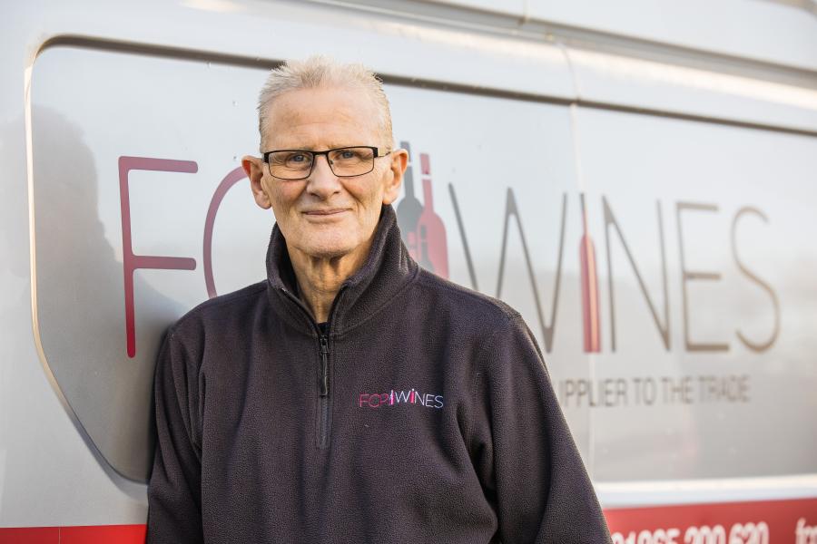 Kieth standing by the delivery van 