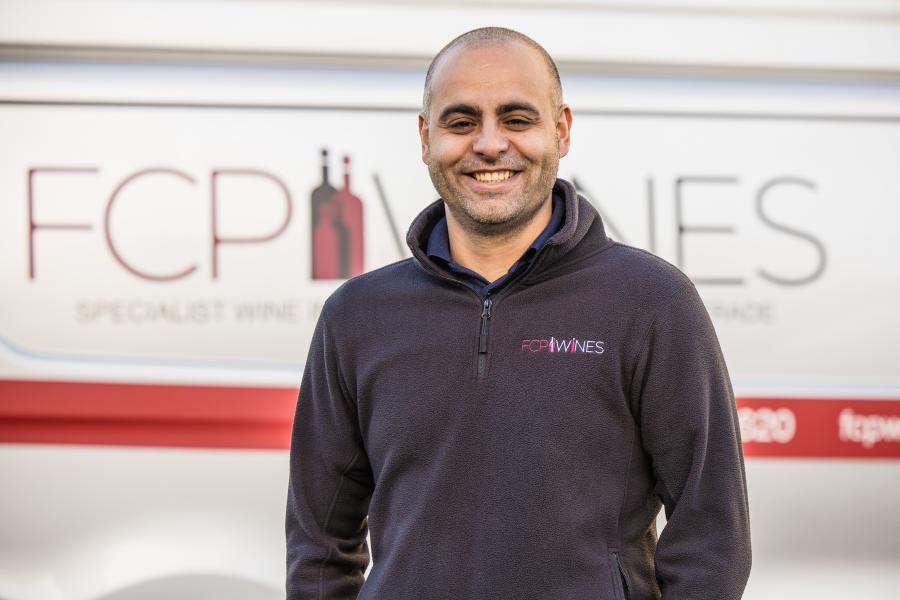 Marian standing by a van posing for photo