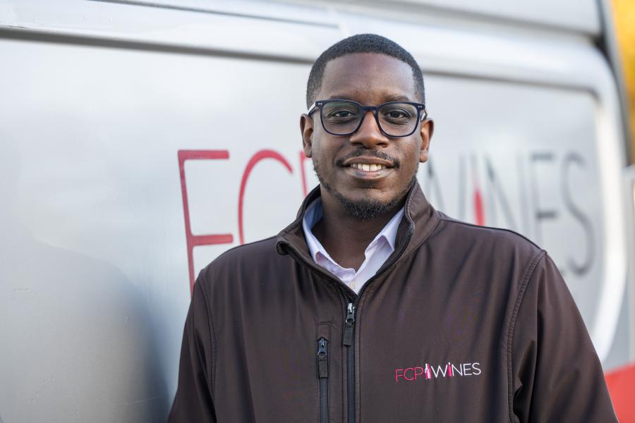 Theo Woods standing by the delivery van 
