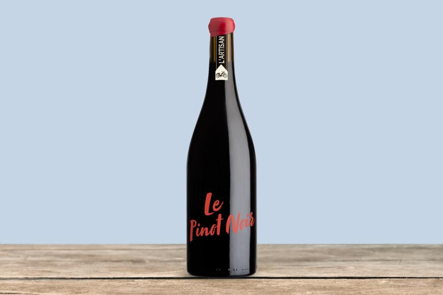 A bottle of wine with light blue background