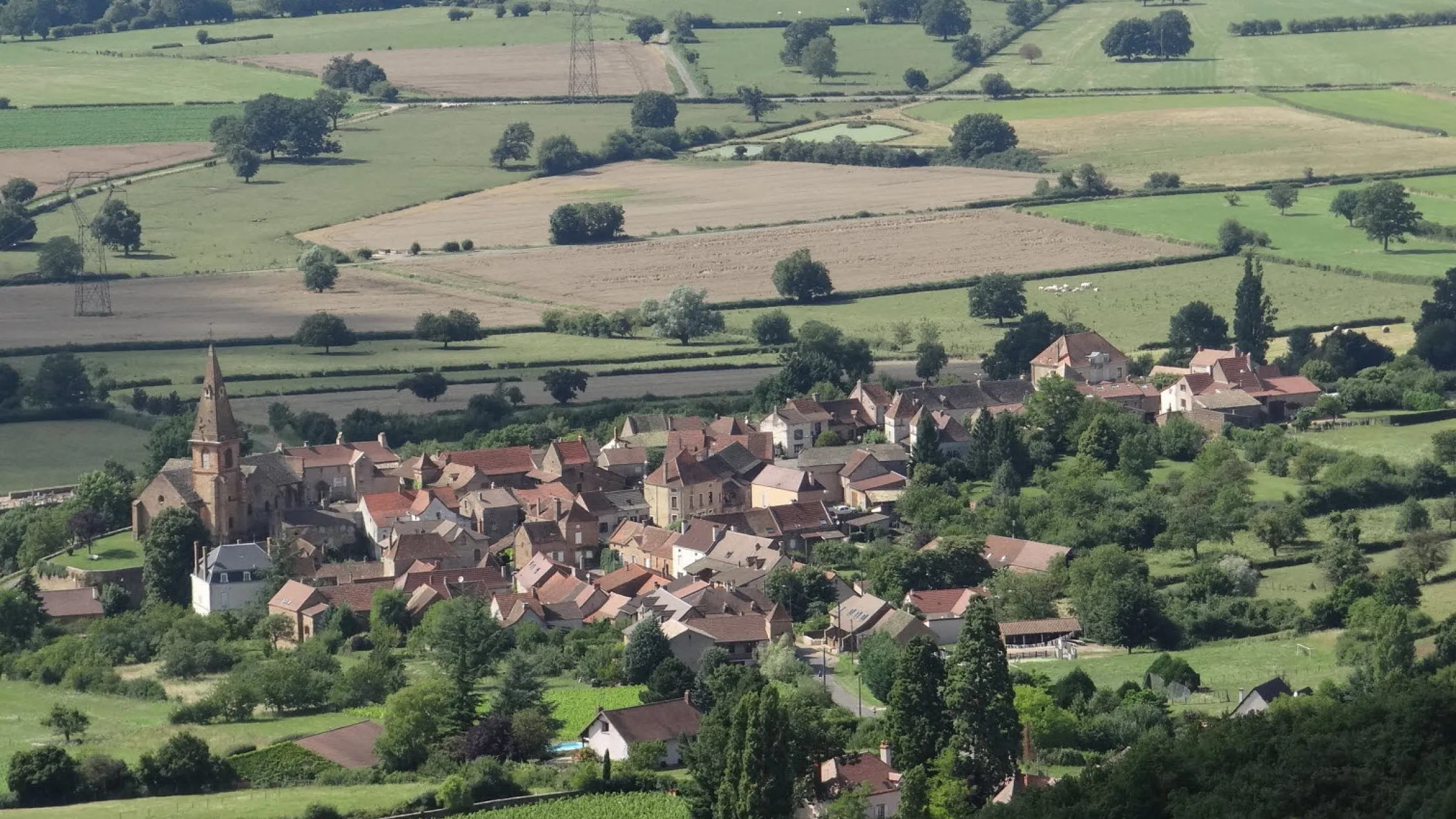 Eagle view of a town surrounded by fields