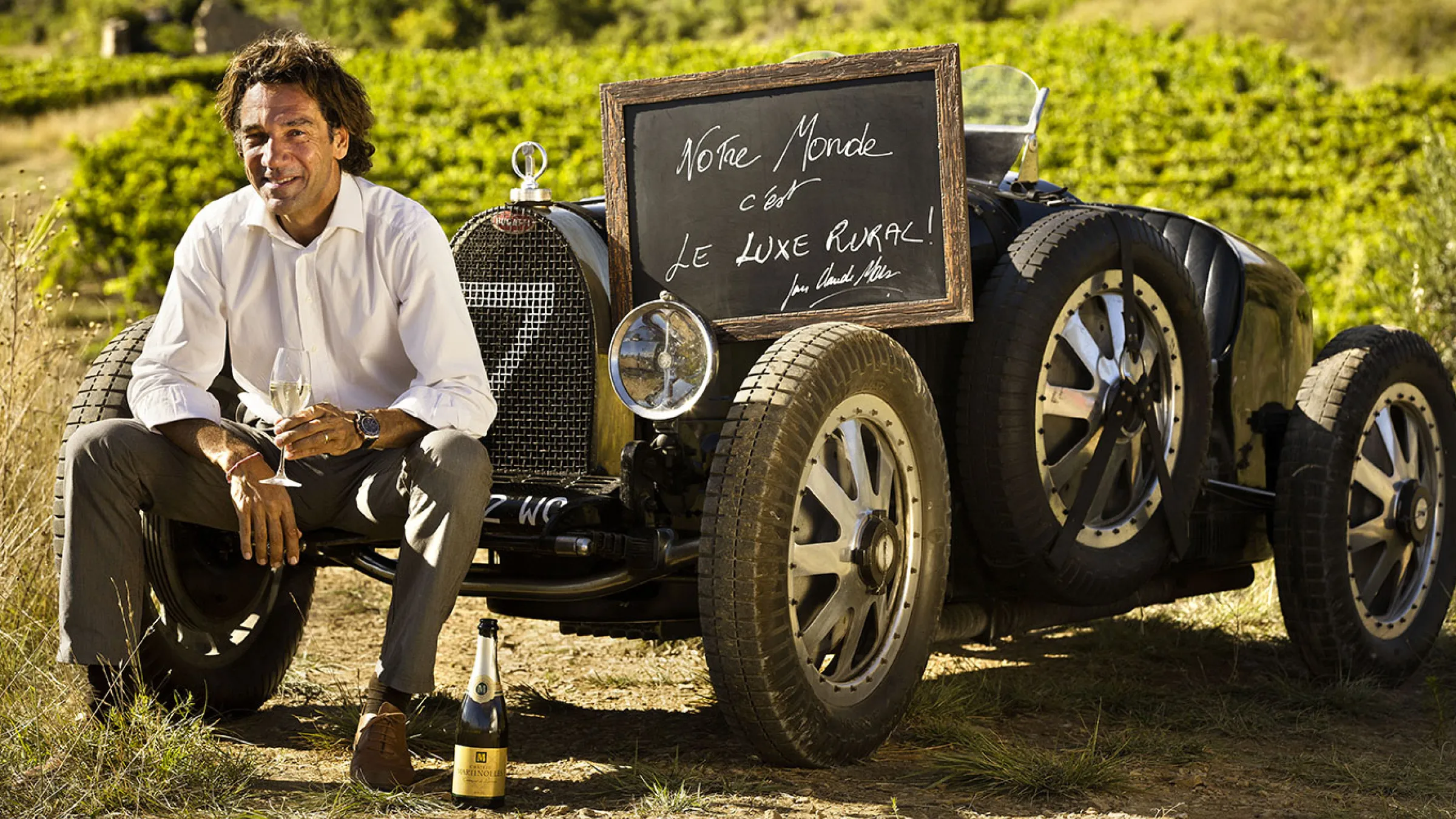 Paul Mas with a vineyard in the background 