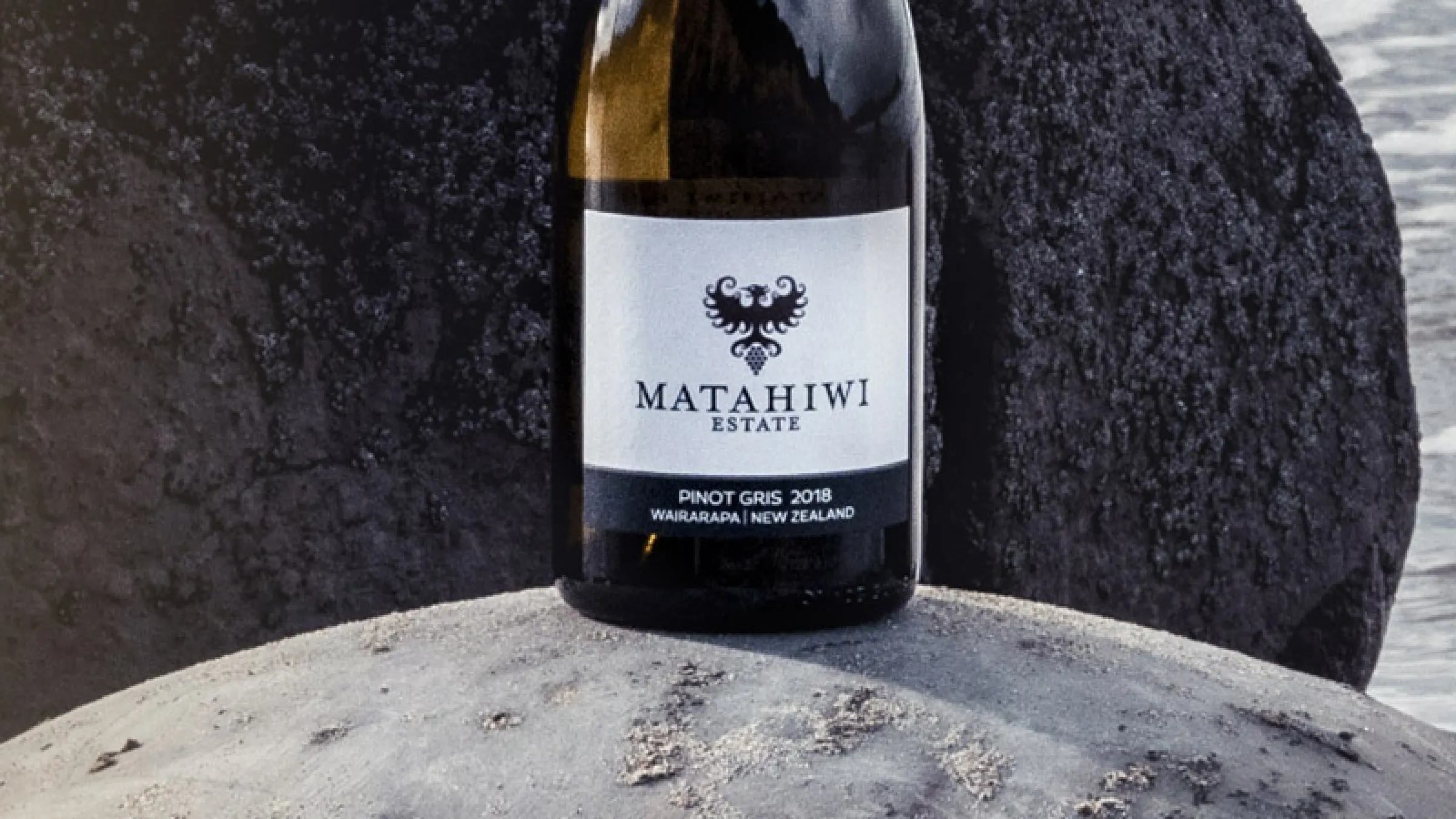 A bottle of red wine in a collage