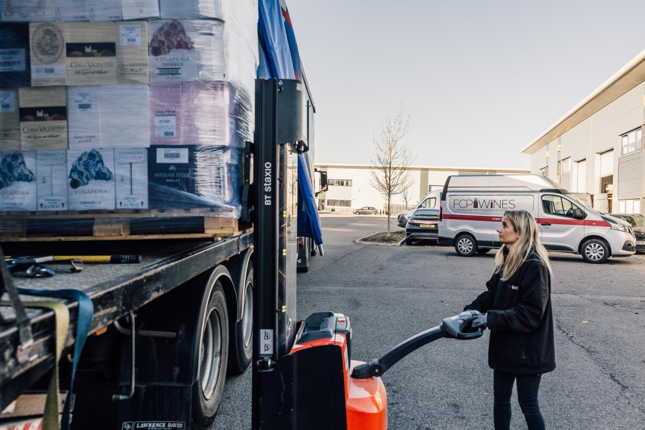 Staff member unloading a truck 