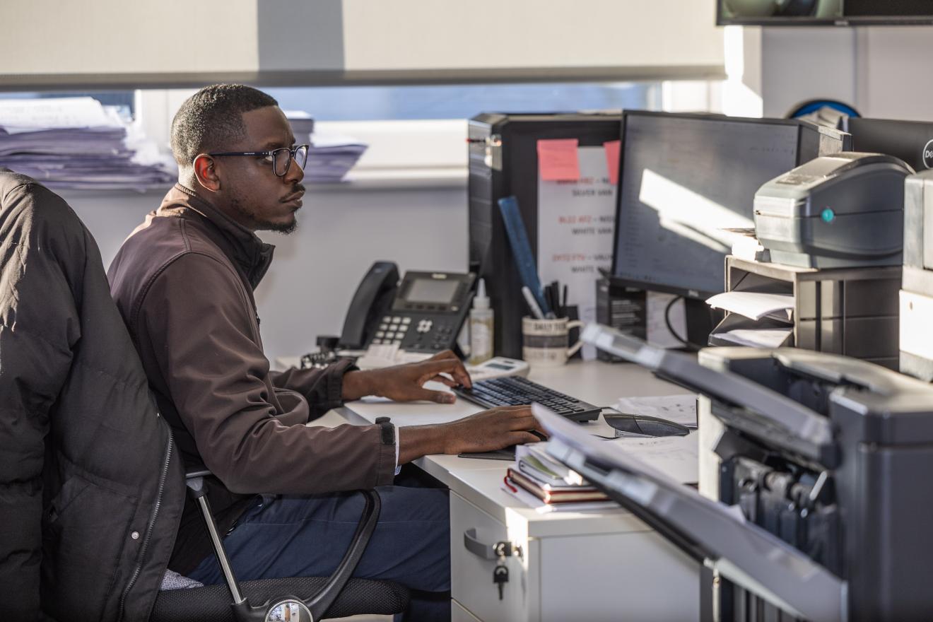 First Class Products staff member designing menus in the office