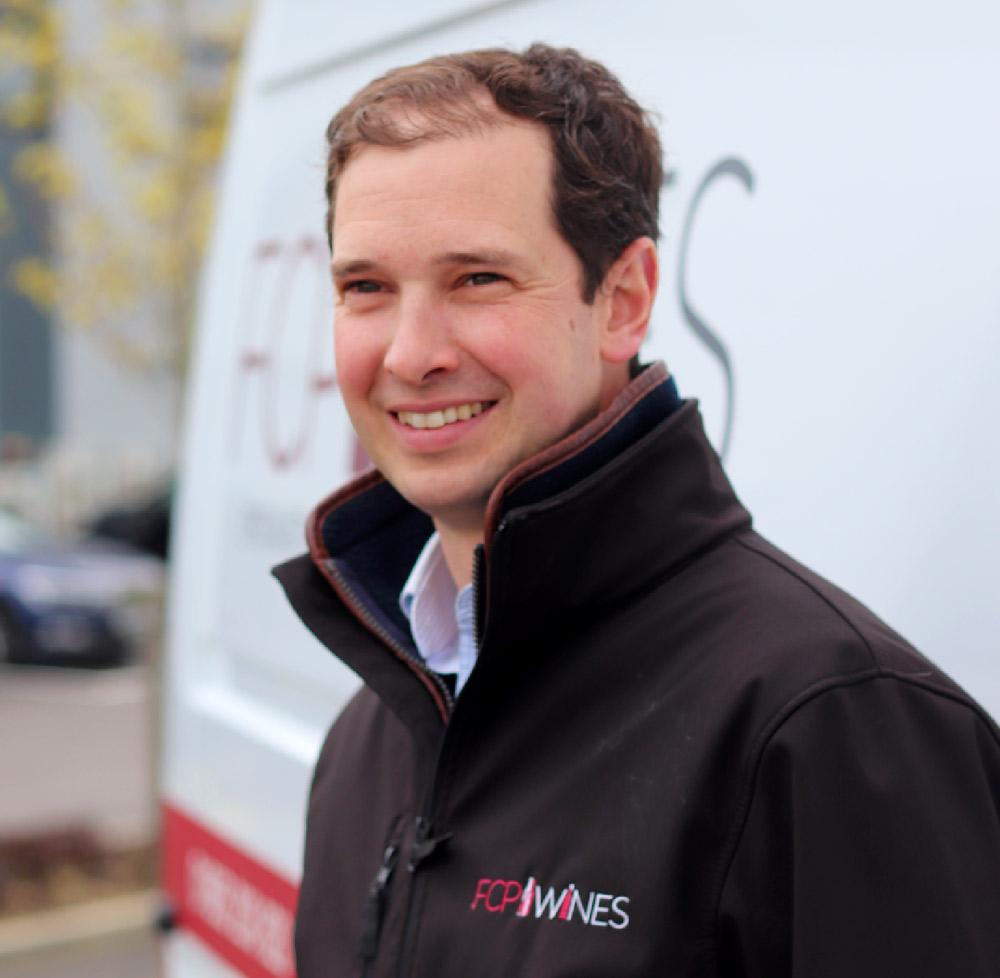 Tom Ellis smiling for the camera 